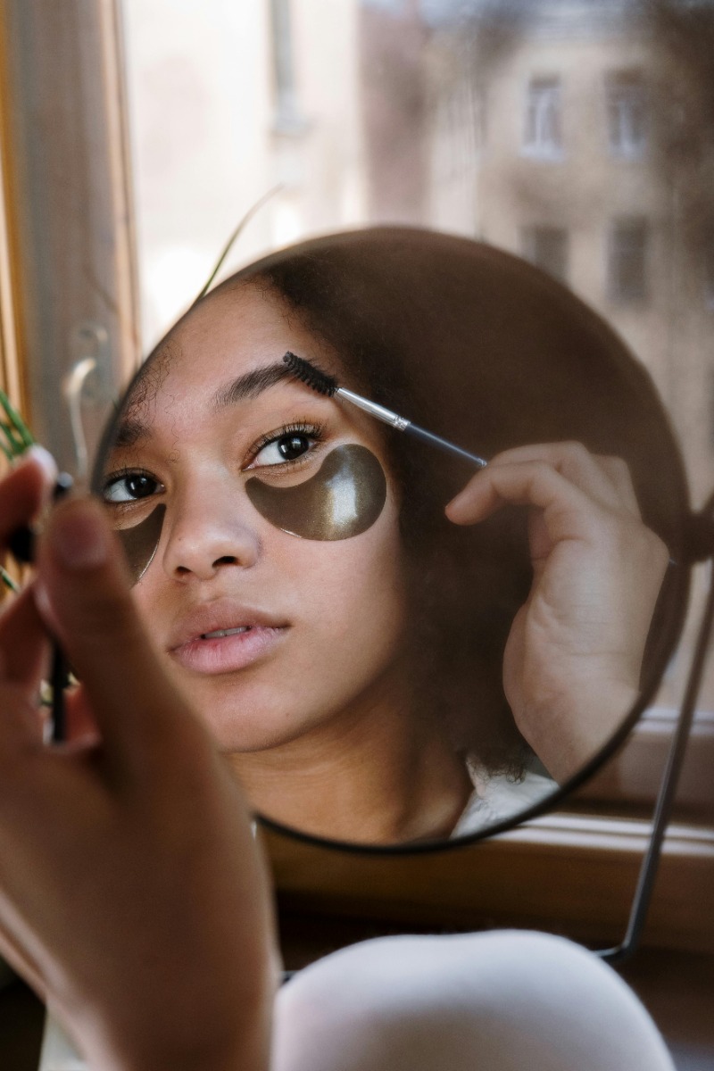 Woman showcasing permanent eyebrow shaping after electrolysis at Nios Spa in NYC