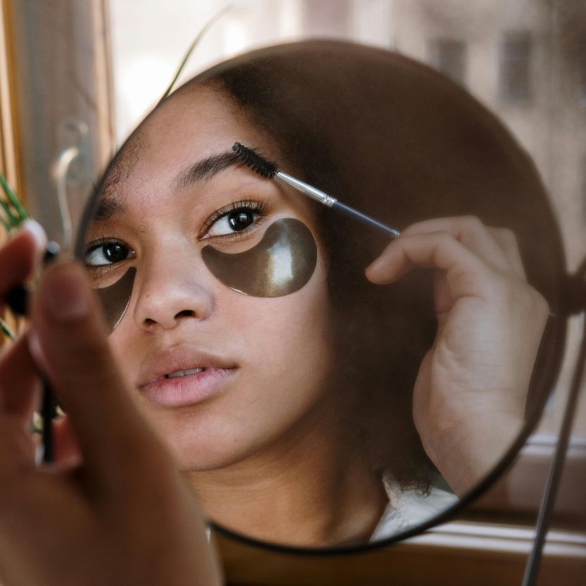 Woman showcasing permanent eyebrow shaping after electrolysis at Nios Spa in NYC